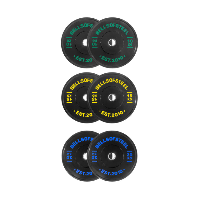 Six black Dead Bounce Conflict Bumper Plate Sets from Bells of Steel, labeled 10 kg, 15 kg, and 20 kg in green, yellow, and blue text, are arranged in pairs on a white background for optimal dead bounce performance.