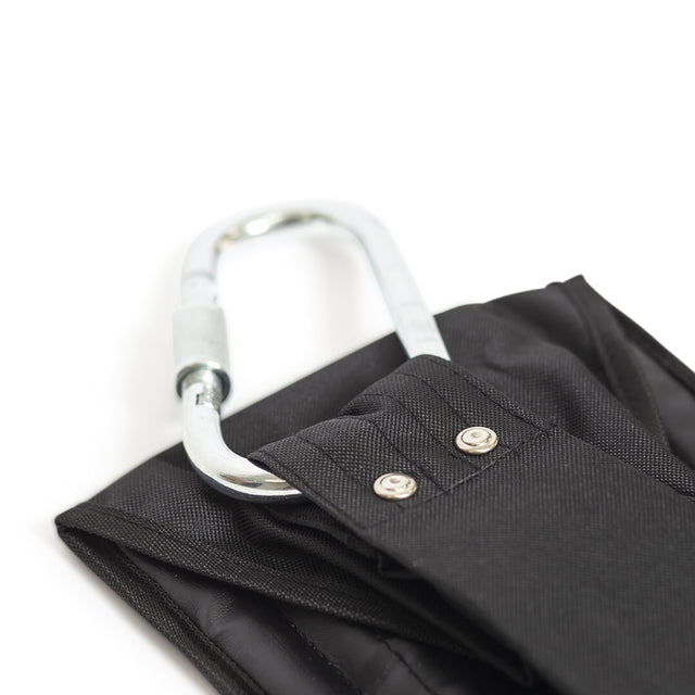 Close-up of a silver carabiner clipped to a black fabric loop with metal rivets, part of the Bells of Steel Hanging Ab Straps (Pair), designed for effective core workouts, shown on a white background.