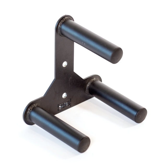The Bells of Steel Change Plate Storage Pegs is a black metal triangular bracket with three cylindrical rods, designed as a power rack attachment to organize Olympic change plates in your gym setup.