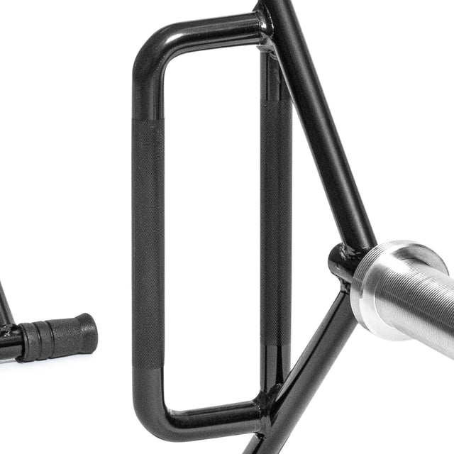 Close-up of the Bells of Steel Open Trap Bar / Hex Bar shows its black metal rectangular handle, threaded bar, and partial handle. Rotating sleeves hint at its trap bar design. The equipment stands out against a white background.