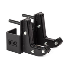 Two black metal Bells of Steel Sandwich J-Cups with bolts and BOS logo are shown on a white background, designed as heavy-duty squat rack attachments for holding weightlifting bars.