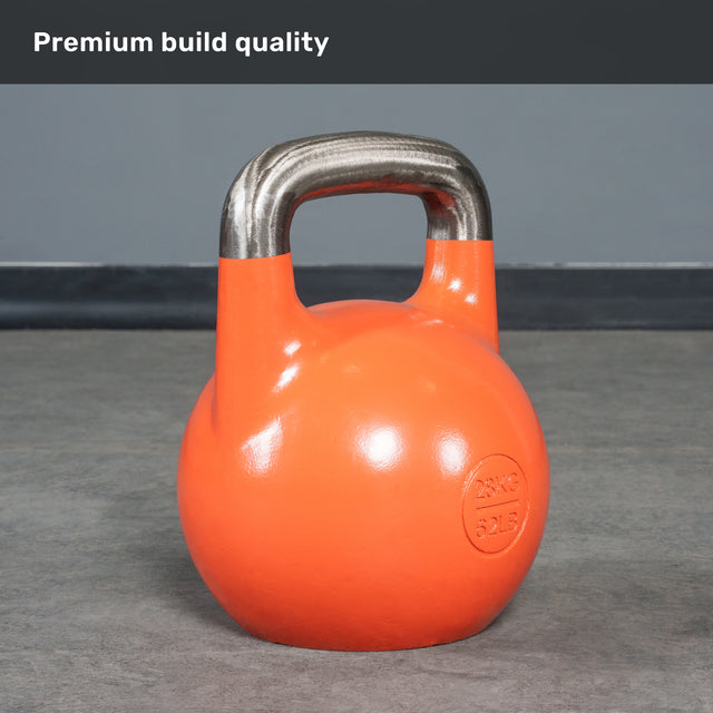 A 28 kg (62 lb) orange Bells of Steel Competition Kettlebell with a metallic handle rests on a gray floor. The phrase “Premium build quality” is displayed at the top on a gray banner, emphasizing the consistent size and colour-coded design of these Competition Kettlebells.