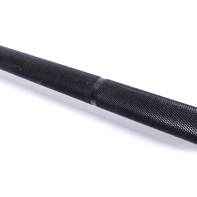 A close-up of the Bells of Steel Powerlifting Bar’s black textured shaft, featuring knurling and a clear knurl mark, built to IPF specs and shown isolated on a white background.