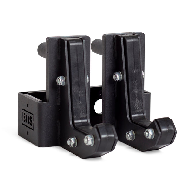 A pair of black Bells of Steel Sandwich J-Cups, made from metal and plastic for heavy-duty support, are essential squat rack accessories. Both are shown side by side on a white background.