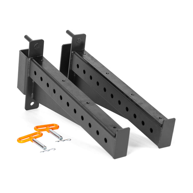 Shown is a pair of black metal Spotter Arms Rack Attachments from Bells of Steel, featuring multiple holes for adjustable height. Two orange safety pins with linchpins are also included, placed in front on a white background.