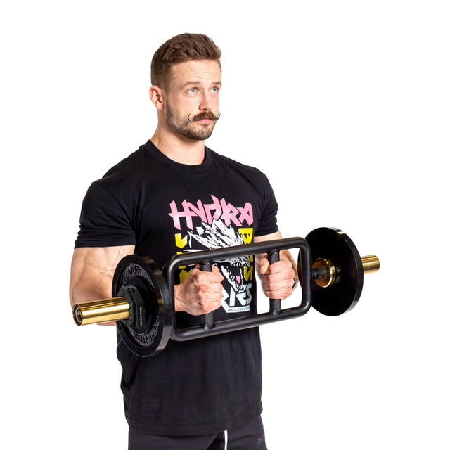 A mustached man in a black graphic tee holds a rectangular barbell fitted with Bells of Steel Magnetic Clamp Collars at chest height, preparing to lift against a plain white background.