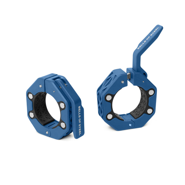 Two blue, octagonal Bells of Steel Magnetic Clamp Collars are shown: one stands closed and upright with the logo on its side, while the other lies open with its lever raised.