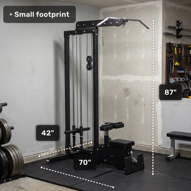 The Bells of Steel Lat Pulldown Low Row Machine is shown in a garage with labeled dimensions: 42" wide, 70" long, and 87" tall. “Small footprint” appears in the top left. Weight plates and gym accessories are nearby.