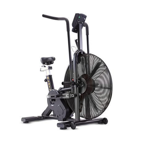 A stationary air bike with a large fan wheel, black frame, adjustable seat, and handlebars, designed for indoor cardio workouts.