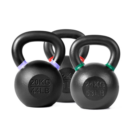Three black kettlebells with colored markings: 20KG/44LB with a purple band, 24KG/53LB with a green band, and another 20KG/44LB with a red band, arranged in a line.