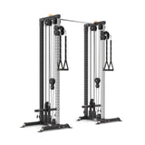 The Bells of Steel Cable Tower Squat Stands feature adjustable pulleys, a black frame, silver columns, and two handles per side—making this versatile machine ideal for strength training exercises.