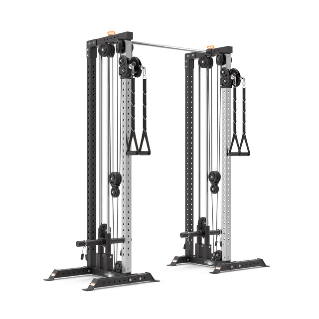 The Bells of Steel Cable Tower Squat Stands feature two weight stacks, pulleys, handles, a pull-up bar, and a wide black and silver frame—ideal for strength training and functional fitness exercises.