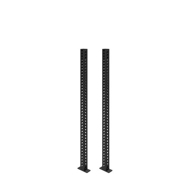 Two black Manticore Vertical Uprights by Bells of Steel, each 3x3 with evenly spaced holes, stand upright on flat bases against a white background, ready for various rack attachments.