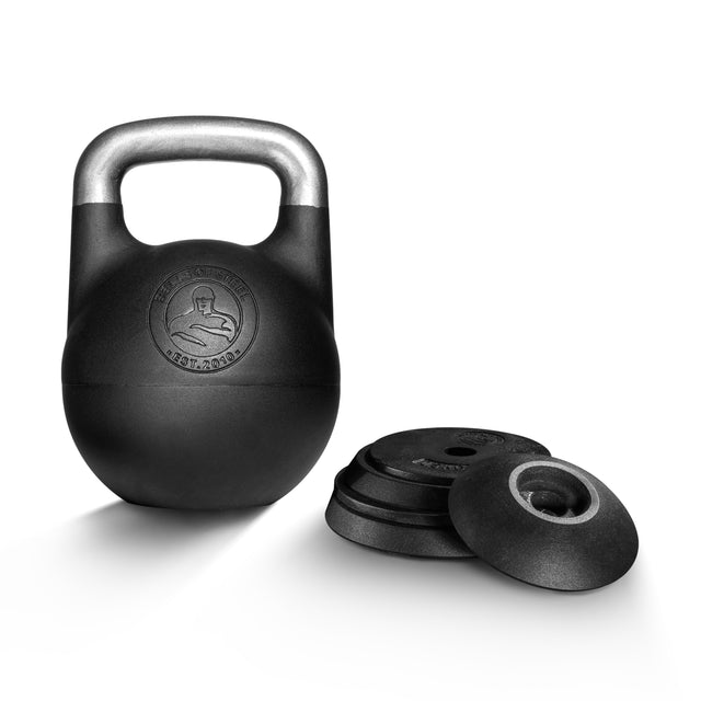 The Bells of Steel Adjustable Competition Kettlebell with a silver handle stands upright beside removable weight plates on a white background. This kettlebell features the brand logo on the front, ideal for kettlebell training.