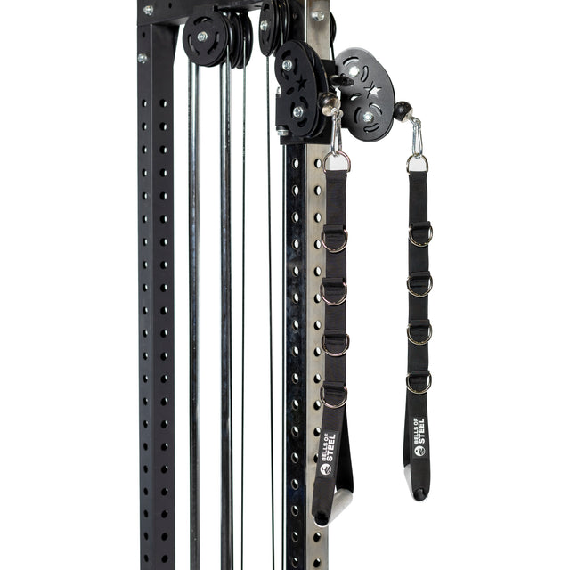 A close-up of Bells of Steel Adjustable Length Aluminum Handles, paired with metal rings on a gym machine. The black frame’s multiple holes allow for handle adjustments, making these handles versatile gym accessories.