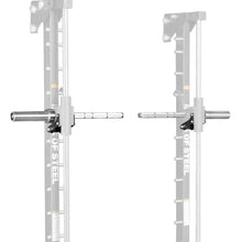 Two Anvil Handles by Bells of Steel, designed as Smith Machine Handles, are attached to a squat rack and face each other. The handles are silver with black brackets, while most of the squat rack is faded out in the background.