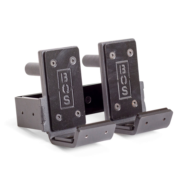 The Bells of Steel Standard J-Cups are black metal, feature BOS logos and UHMW barbell protection, and attach securely to a power rack. Shown side by side on a white background.