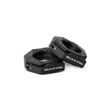 Two black, octagonal Magnetic Clamp Collars by Bells of Steel are shown on a white background, with one collar upright and the other angled. The brand name "BELLS OF STEEL" appears in white on each weight plate collar.