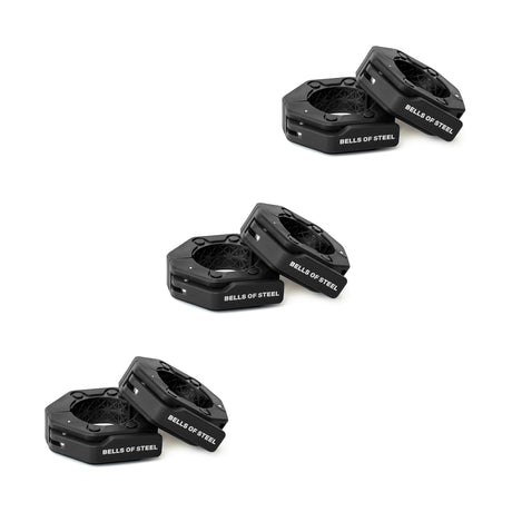 Three pairs of black, octagonal Magnetic Clamp Collars from Bells of Steel are arranged diagonally on a white background. Each pair is stacked together, with one collar slightly tilted atop the other. Ideal for use with barbells.