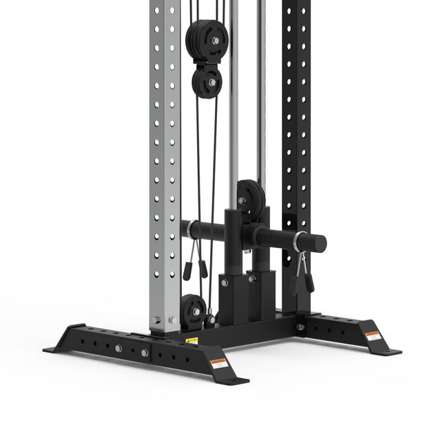 Close-up of the Bells of Steel Cable Tower's lower section, showing metal columns with holes, weight stack, black base supports, pulleys, and cables designed for strength training exercises.