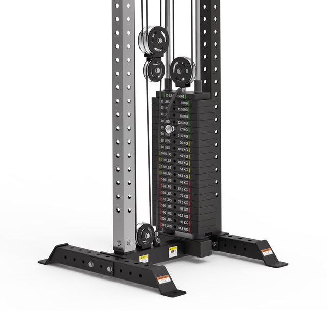 A close-up of the Bells of Steel Cable Tower’s weight stack, featuring labeled plates in pounds and kilograms. The black and silver frame includes adjustable holes and supports Adjustable Handles.