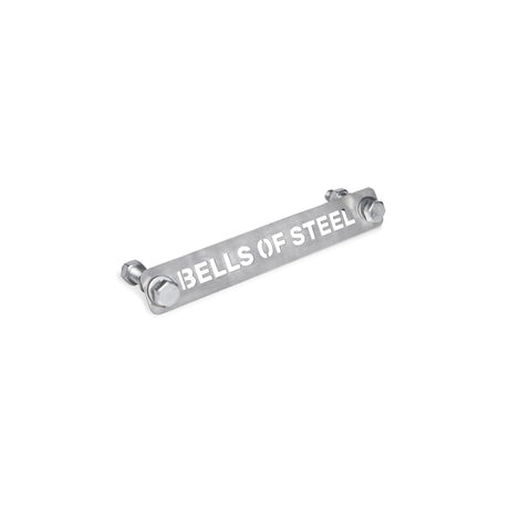 A metallic nameplate engraved with "Bells of Steel" featuring bolts on each end is set against a white background, known as the Manticore BOS Logo Tag (FREE FOR BUILDERS).