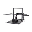 Studio shot of the Bells of Steel Belt Squat Machine in black metal, perfect for home gyms. It includes handles, a platform, and features chains and pulleys for lower body strength training, all against a white background.
