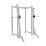 The Bells of Steel Smith Machine Rack Attachment is mounted on a 3x3 rack shown in faded gray, while the attachment, barbell, and clamp collars appear solid black to highlight this versatile power rack accessory.