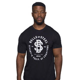 A man with short hair and a trimmed beard faces forward against a plain white background, wearing a black Bells of Steel Bamboo T-Shirt with white lettering.