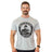 A smiling man with a mustache and short hair wears the Bells of Steel Bamboo T-Shirt, featuring sweat-wicking fabric and "Est. 2010" text, standing with arms relaxed at his sides against a white background.