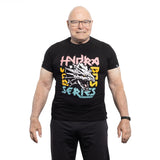An older, bald man with glasses smiles against a white background. He sports a black Bells of Steel Bamboo T-Shirt featuring colorful "Hydra Bass Series" text encircling an illustrated dragon head.