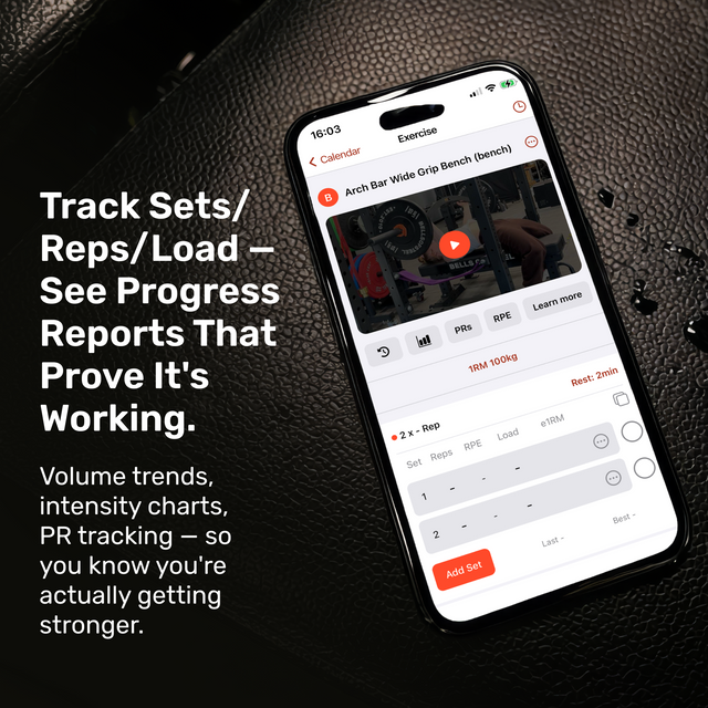 A smartphone on a leather surface shows the Bells of Steel Online Coaching app, highlighting features like personal training, set and rep tracking, load monitoring, progress reports, PR tracking, and intensity charts.