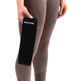 A person in taupe leggings holds a black Bells of Steel Glute Loop resistance band in their left hand, ideal for booty workouts, against a plain white background.