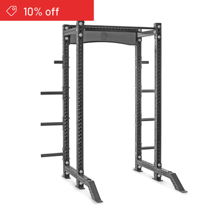 The Bells of Steel Hydra Collegiate Power Rack Builder (3" x 3", ⅝" Holes) is a black weightlifting rack with adjustable uprights, side storage pegs, and a sturdy frame. A red banner in the top left corner shows "10% off.