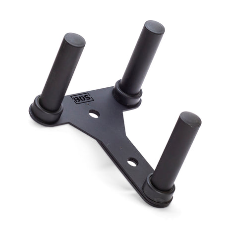 The Bells of Steel Change Plate Storage Pegs feature a black metal base with three upright pegs in a triangular layout, ideal for neatly organizing Olympic change plates next to your power rack.