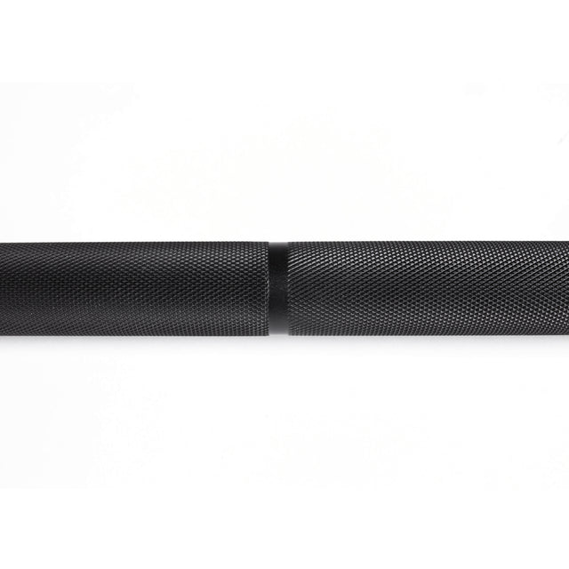 A close-up of the Bells of Steel Olympic Weightlifting Barbell on a white background highlights its black, textured finish, knurled grip, and smooth central ring—an ideal choice for top value and quality.
