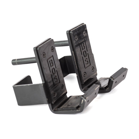 A pair of Bells of Steel Standard J-Cups, made from black metal with UHMW liners, designed for securely holding weightlifting bars on a power rack.