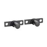 Two Bolt-On Plate Pegs from Bells of Steel, designed with black metal cylindrical magnets and rectangular bases featuring two screw holes, are positioned side by side against a plain white background. Their robust design is as sturdy as a power rack, ensuring a reliable hold for any application.