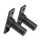 The Bolt-On Plate Pegs by Bells of Steel are a pair of sleek black metal brackets with cylindrical pegs and mounting plates, each featuring two holes for screws. These brackets are designed to be compatible with power racks, providing a sturdy support system that is perfect for Olympic-sized weight plates. They are positioned against a white background, highlighting their robust design.