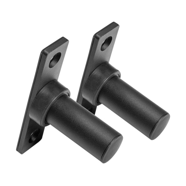 The Bolt-On Plate Pegs by Bells of Steel are a pair of sleek black metal brackets with cylindrical pegs and mounting plates, each featuring two holes for screws. These brackets are designed to be compatible with power racks, providing a sturdy support system that is perfect for Olympic-sized weight plates. They are positioned against a white background, highlighting their robust design.