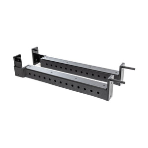 The Bells of Steel Flip-Down Safeties are two black metal adjustable brackets with multiple mounting holes, designed for power rack training safety and equipment support, shown on a white background.