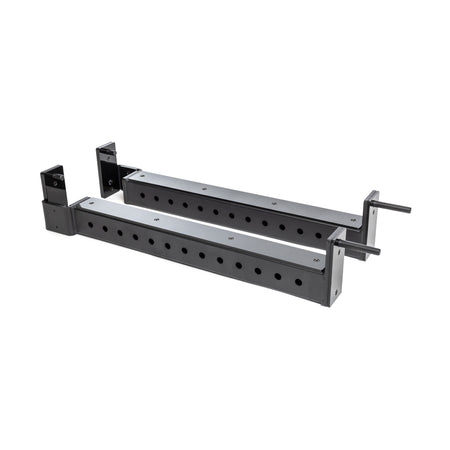 The Bells of Steel Flip-Down Safeties are two black metal adjustable brackets with multiple mounting holes, designed for power rack training safety and equipment support, shown on a white background.