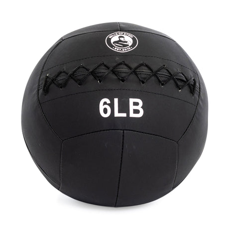 The Bells of Steel's Triple Stitched Medicine Ball is black with a Kevlar outer shell, visible logo, crisscross stitching, labeled "6 LB," and part of a collection with various weights.