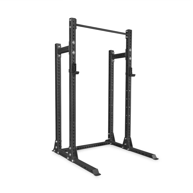 The Bells of Steel Hydra Half Rack - Prebuilt (3" x 3", ⅝" holes) features a black metal frame, adjustable holes, pull-up bar, and sturdy base—ideal for weightlifting and strength training in any home gym.