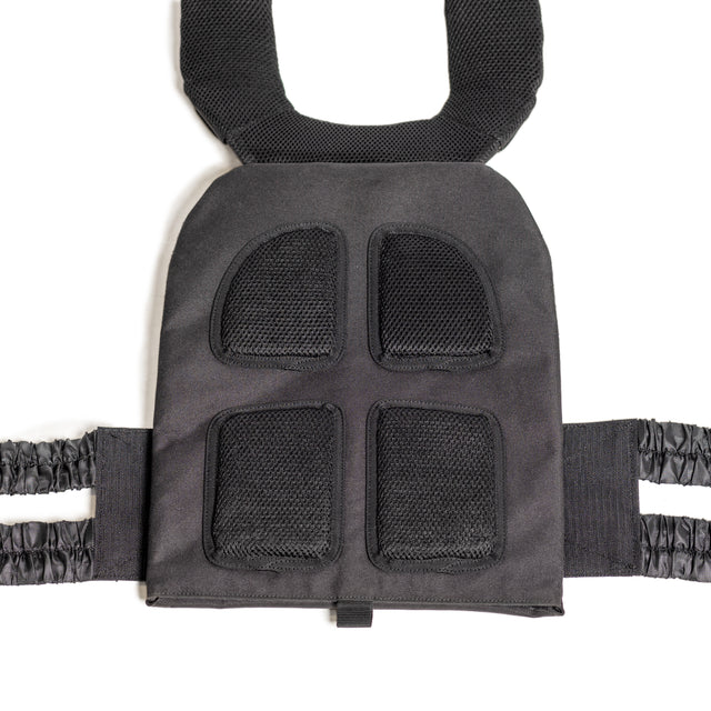 The Bells of Steel Weighted Vest features a close-up of its black padded shoulder strap with mesh cushioning for comfort. The adjustable strap connects to a cushioned section with four mesh-covered pads for ventilation, while elasticated bands on the sides ensure a snug fit during workouts.